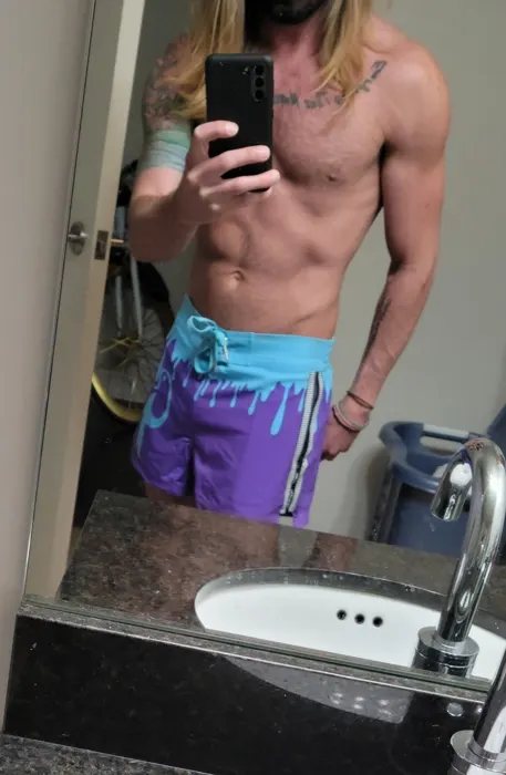 Customer photo from Josh E. review of Drip Series Swim Shorts - Blue Drip