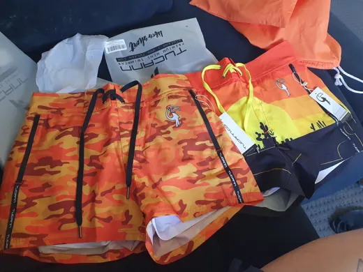 Customer photo from Ayrton B. review of Orange Camo Swim Shorts